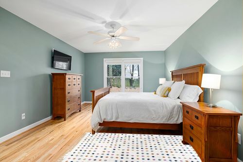 Filson Polka Dots Beige Area Rug Mack & Milo Rug Size: Rectangle 4' x 6' in Teal and Orange Wood Bedroom