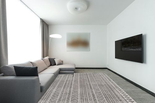 Signature Design by Ashley Brinoy 8 x 10 Geometric Tribal Design Rug, Black & White in Modern Living Room with Grey Couch