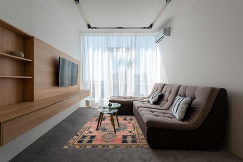 Loloi II Jocelyn Collection JOC-06 Rose/Rose 5'-5" x 7'-6" Area Rug in Grey Living Room with Brown Couch