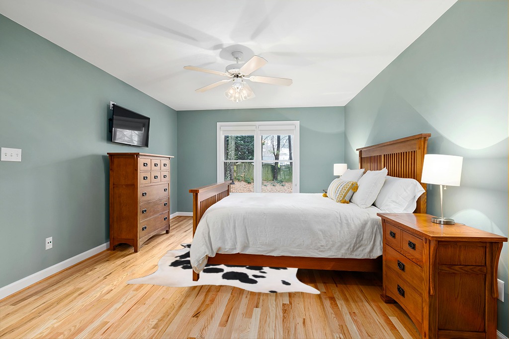 Home Must Haves Cowhide Rug, 6' x 7', Black and White in Teal and Orange Wood Bedroom