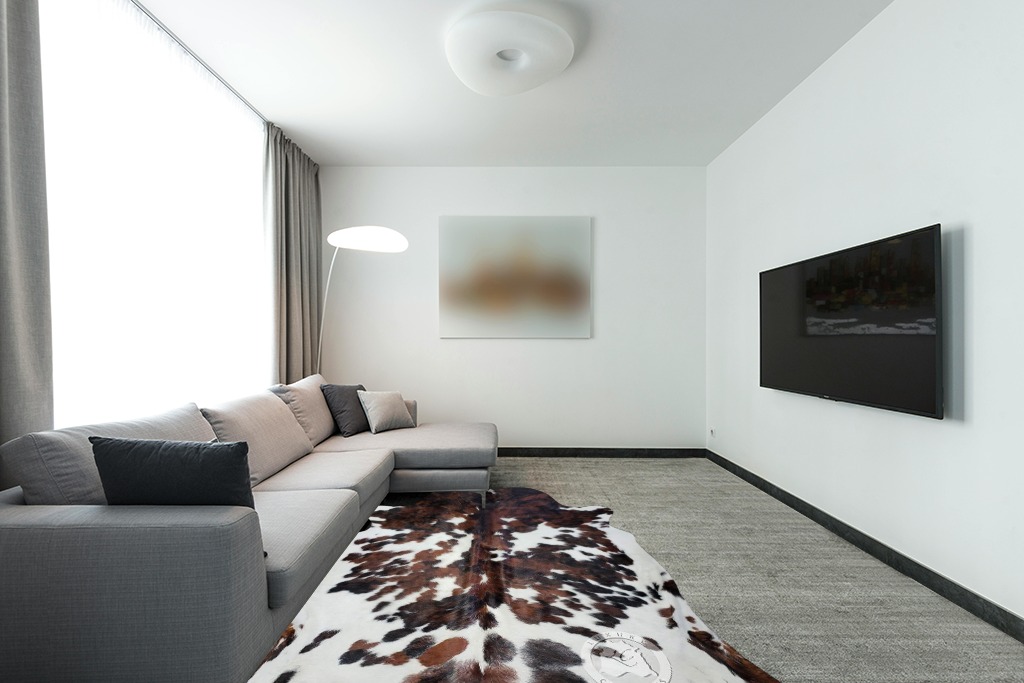 Sunshine Cowhides Genuine Tricolor Brindle Cowhide Rug - Luxurious Cow Rug for Bedroom, Living Room, and Home Decor Enthusiasts - Masterpiece of Style and Functionality - XL 6x7-8ft (180x240cm) in Modern Living Room with Grey Couch