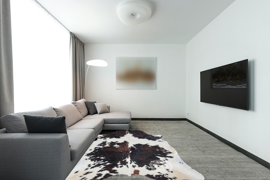 Sunshine Cowhides Genuine Tricolor Cow Skin Leather Cowhide Rug - Luxurious Cow Rug for Bedroom, Living Room, and Home Decor Enthusiasts - Masterpiece of Style and Functionality - XL 6x7-8ft in Modern Living Room with Grey Couch