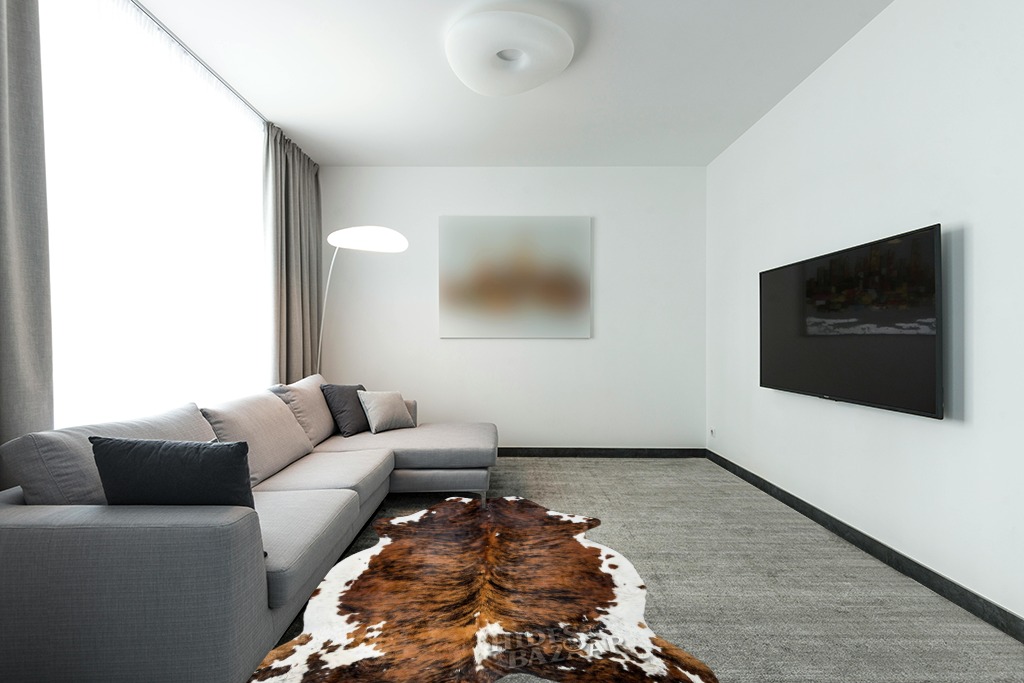 HIDES BAZAAR Brown Brindle Cowhide Rug, Premium Quality Genuine Leather Cow Hide, Brown, Black and White Area Rug (5x7 ft) in Modern Living Room with Grey Couch