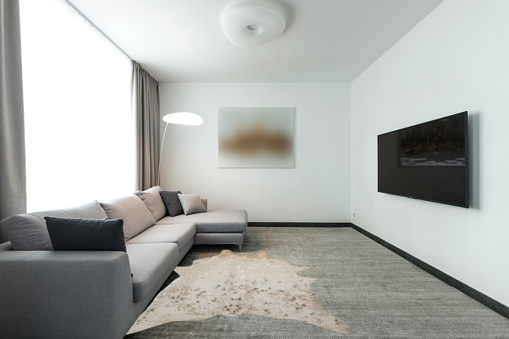 LAKKH Fourtue 4.2x6ft Faux Cowhide Rug - Synthetic Cow Hide Rug - Cowhide Rug Faux - Cowhide Rugs for Living Room Bedroom & Home Office - Plush Synthetic Fur w/ Soft Backing (Gold & Cream) (L-02) in Modern Living Room with Grey Couch