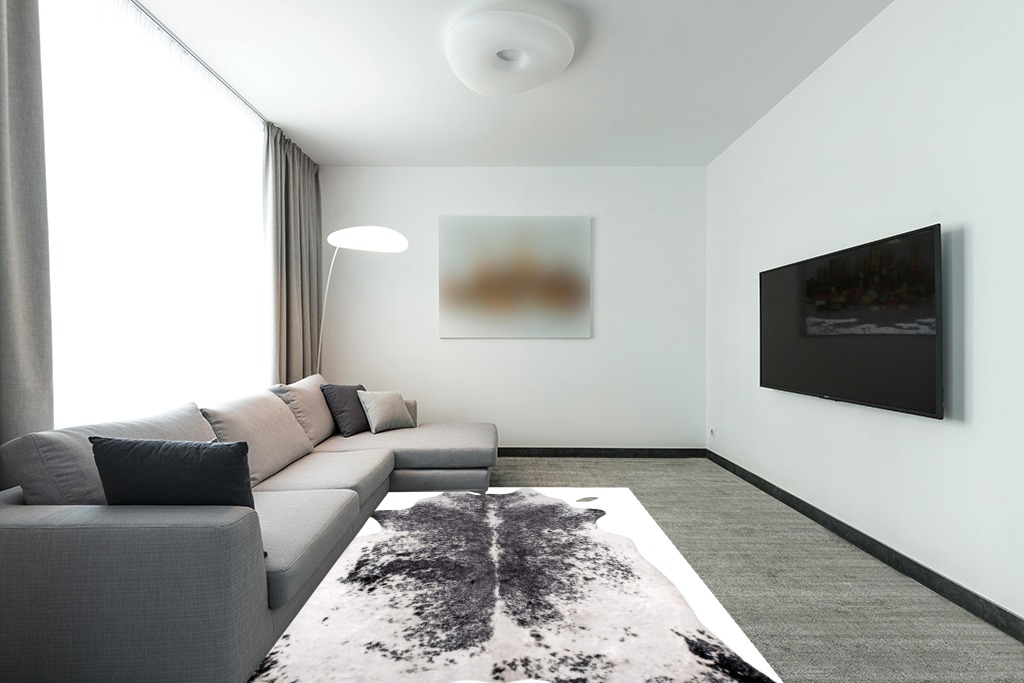 nuLOOM Halina Faux Cowhide Area Rug, 5' 9" x 7' 7", Black in Modern Living Room with Grey Couch