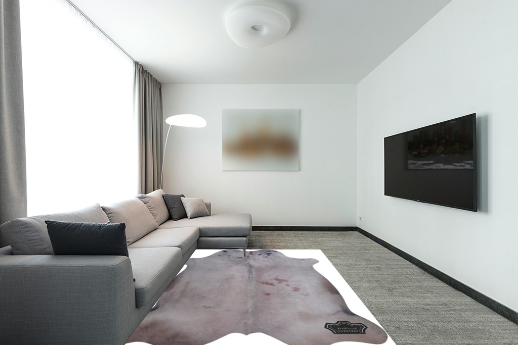 Appaloosa Cowhides Color Dyed Collection (Soft Gray) in Modern Living Room with Grey Couch