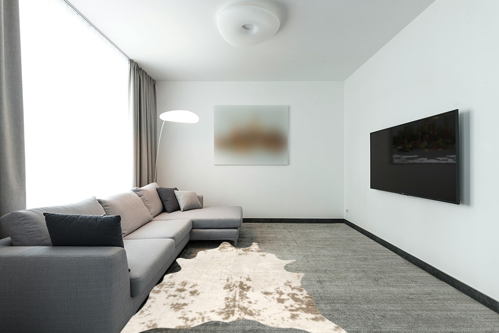 nuLOOM Marcia Machine Washable Faux Cowhide Area Rug, 5' x 6' 7", Off-White in Modern Living Room with Grey Couch