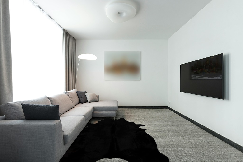Faux Fur Cowhide Rugs (5 * 7 ft), Machine Washable Cow Print Area Carpet Black Color with Non-Slip Suede Backing, Durable & No Shedding in Modern Living Room with Grey Couch