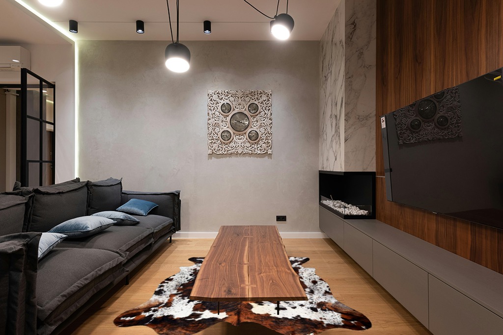 Prime Cowhides Cowhide Rug Tricolor Genuine Hair on Hide Size: Medium (5ft x 6ft) (150cm x 180cm) in Dark Wood Living Room with Black Couch