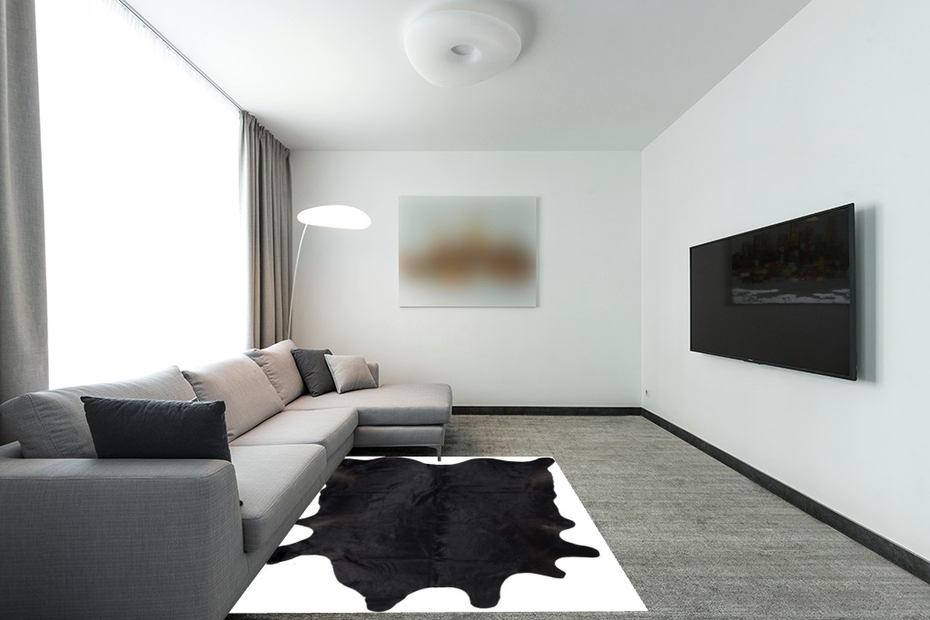 Gaucho Cowhides Solid Black Cowhide Rug - Natural Product in Modern Living Room with Grey Couch