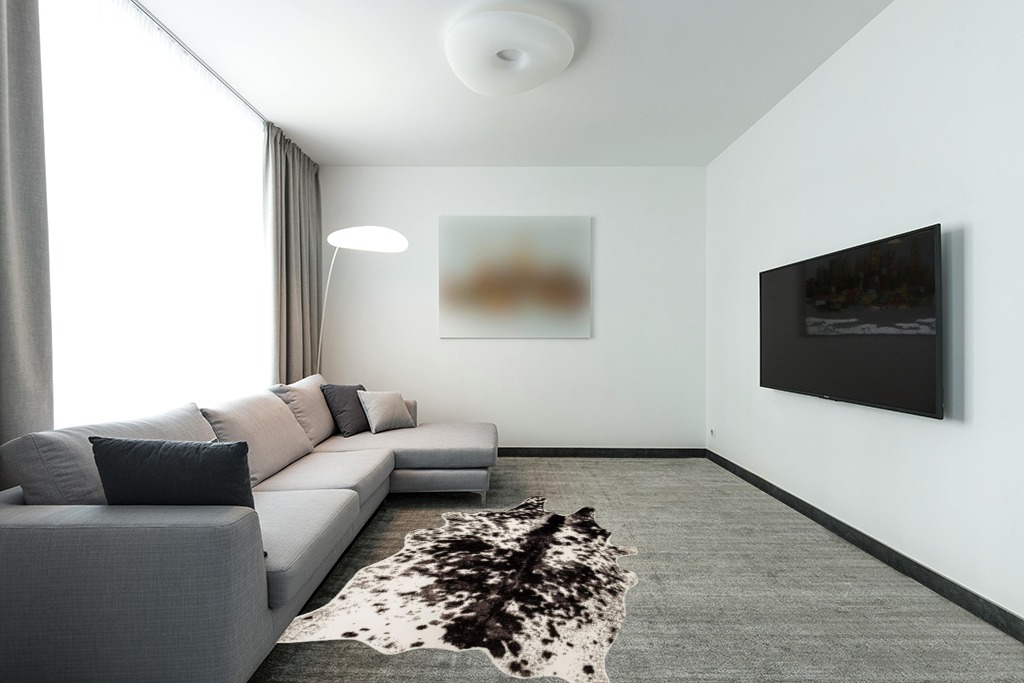 MustMat Faux Cowhide Rug Black and White Cow Print Area Rug Large Animal Hide Carpet Western Decor 5.2ft x 6.6ft in Modern Living Room with Grey Couch