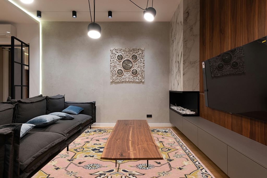 Restoration and Renovation Handmade Traditional Oriental Premium Wool Area Rug | Vintage-Inspired, Hand-Tufted Design with Multi-Colored Accents for Home Decor (Pink, 5' Round) in Dark Wood Living Room with Black Couch