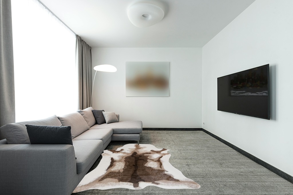 KOOBAYR Faux Cowhide Rug 5x6 feet - Cow Print Rug - Synthetic Cowhide and Western Decor Rug - Cow Rugs for Living Room Bedroom & Office Machine Washable Rug in Modern Living Room with Grey Couch