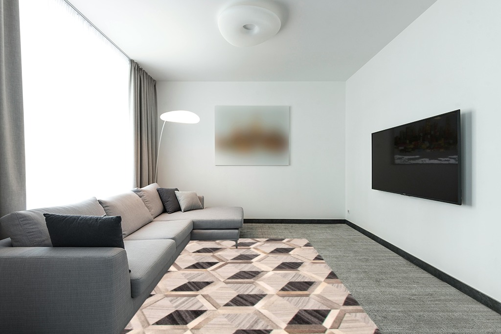 eCarpet Gallery Hand-Knotted | Area Rug for Living Room, Bedroom | Cowhide Patchwork Accent Grey Rug 5'6" x 7'7" | 350680 in Modern Living Room with Grey Couch