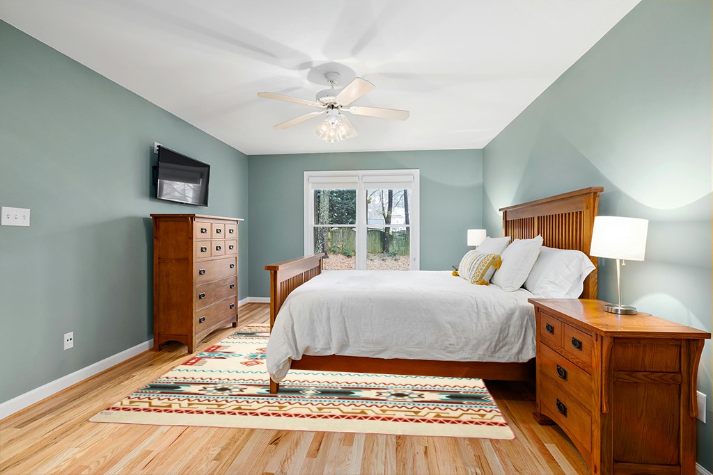 Ecuadane Large Southwestern Woven Blanket in Teal and Orange Wood Bedroom