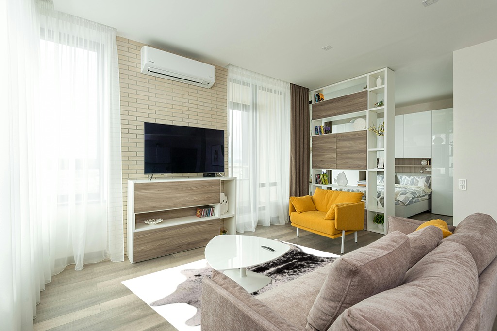 Cowhide Area Rug in Light Modern Living Room with TV