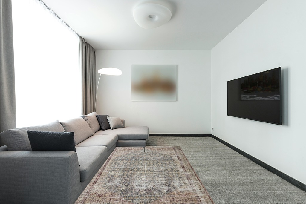 Loloi Amber Lewis x Loloi Georgie Collection GER-04 Teal/Antique 5'-0" x 7'-6" Area Rug in Modern Living Room with Grey Couch