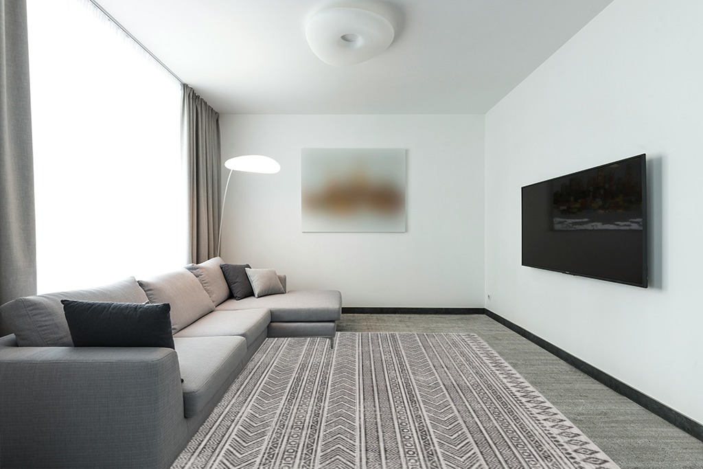 Signature Design by Ashley Brinoy 8 x 10 Geometric Tribal Design Rug, Black & White in Modern Living Room with Grey Couch